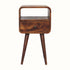 A small chestnut-colored Hamade bedside table with an open slot shelf, a drawer, and a brass knob on a white background.