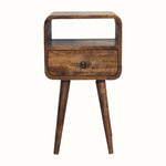 Small bedside table, made from wood in grey wash finish, with open slot shelf, drawer and tapered-style legs.