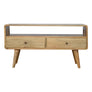 A natural finish Hamade TV stand with an open shelf and two drawers with brass knobs, made from solid mango wood.
