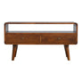 A chestnut finish TV stand with an open shelf and two drawers with brass knobs, featuring a medium-sized flat screen TV.