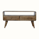 A grey wash finish TV stand with an open shelf and two drawers with brass knobs, featuring a medium-sized flat screen TV.