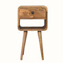 Wooden side table with a single drawer on a white background