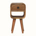 Compact bedside table with storage and tapered legs, in a light brown stain.