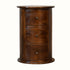 Circular drum table, with three small storage drawers, made from mango wood in a dark brown chestnut finish. 