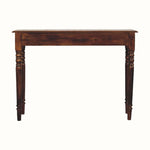 Wooden console table with turned legs on a white background