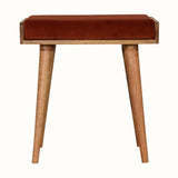 Small square tray-style bench in a brick red velvet, and a natural wooden body.