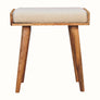 Small square tray-style bench in a cream boucle, and a natural wooden body.