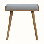 Small square tray-style bench in a grey tweed, and a natural wooden body.