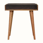 Small square tray-style bench in a grey velvet, and a natural wooden body.