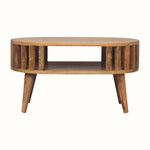 A natural stained mango wood coffee table, featuring open shelving, and slatted design. 