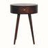 A brown Lauro bedside table made of California walnut, featuring a round tabletop with a single drawer and brass knob.