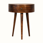 A semi circular shape bedside table made from mango wood in a dark brown finish, featuring a small drawer and single brass knob.