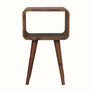 A small natural finish Hamade bedside table with four legs, an open slot compartment, and no visible storage shelves.
