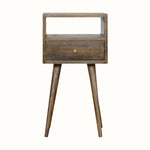 Compact Scandinavian bedside table made from solid wood in grey-wash brown finish.