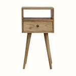 Scandinavian style bedside table made from solid wood in light brown finish.
