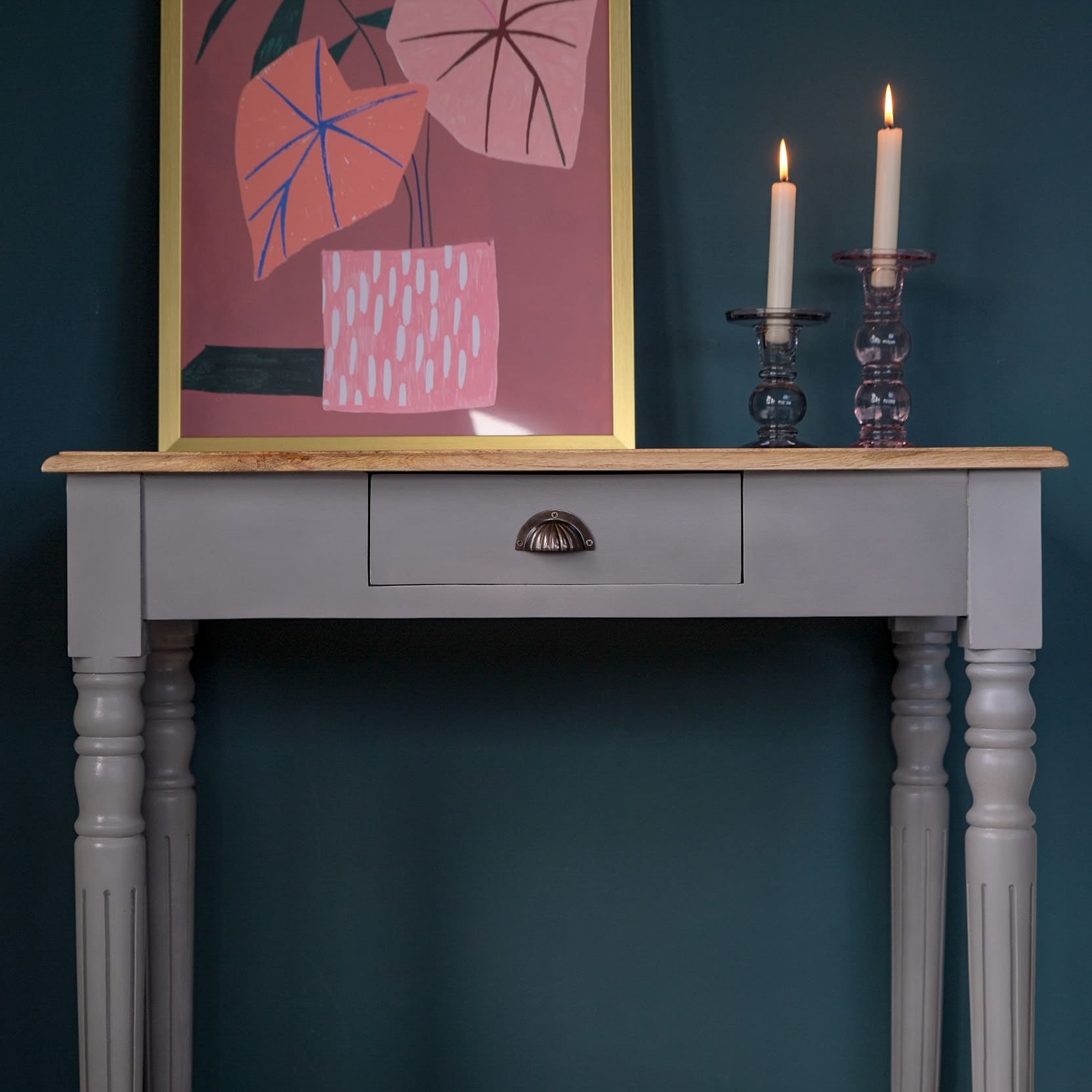 Wooden desk styled as a console in a french grey paint.