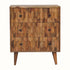 A small chest of drawers with a natural wood finish and brass knobs, featuring a geometric pineapple pattern on the drawer fronts.