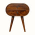 A Merrill 2 Drawer Bedside Table with a chestnut finish, featuring a curved silhouette and Nordic-style legs.