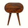A Merrill 2 Drawer Bedside Table with a chestnut finish, featuring a curved silhouette and Nordic-style legs.