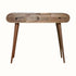 A natural wood dressing table with a curved body and tapered legs.