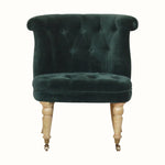 Antique style accent chair in green velvet, with light wood legs.