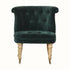 Antique style accent chair in green velvet, with light wood legs.