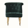 Antique style accent chair in green velvet, with light wood legs.