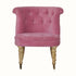 Vintage style seat in pink velvet, with light wood legs.