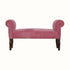 Vintage style bench in a pink upholstery, with wooden legs.