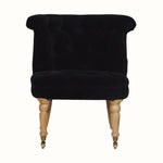 Vintage style seat in black velvet, with light wood legs.