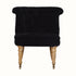 Vintage style seat in black velvet, with light wood legs.
