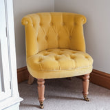 Antique style seat in yellow velvet, with light mango wood legs.