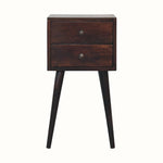 A mini bedside table with two drawers, crafted in solid mango wood with a light walnut finish.