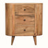 Curved cabinet, with three storage drawers, made from mango wood in a light, natural brown finish. 