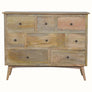 A chest of eight drawers made of mango wood with brass knobs, featuring a traditional Norwegian design with a flat tabletop.