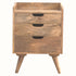 A medium-sized Nordell bedside table made of solid mango wood with a natural finish, featuring three drawers and four tapered legs.