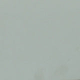 A close up photograph showing our sage green paint sample.