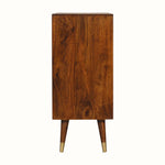 Wooden cabinet with gold feet on a white background