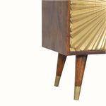Wooden cabinet with gold leaf detailing on a white background