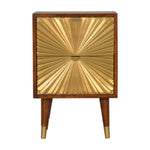 Wooden cabinet with gold sunburst design on a white background