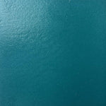 A close up photograph showing our teal paint sample.