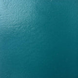 A close up photograph showing our teal paint sample.