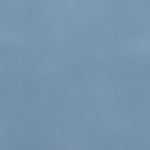 A close up photograph showing our vintage blue paint sample.