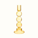 Bubble candle holder in yellow glass.