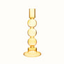 Bubble candle holder in yellow glass.