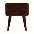 Curved bedside table, in dark wood finish, with two drawers, brass hardware and tapered legs.