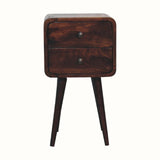 A small bedside table with four legs, made of mango wood in a light walnut finish, featuring two drawers with brass knobs.
