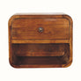 A small chestnut-colored, wall-mounted bedside table with a drawer and an open shelf beneath.