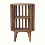A natural finish mango wood bedside table with a slatted design and two open shelves.