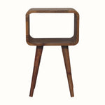 A small natural finish Hamade bedside table with four legs, an open slot compartment, and no visible storage shelves.
